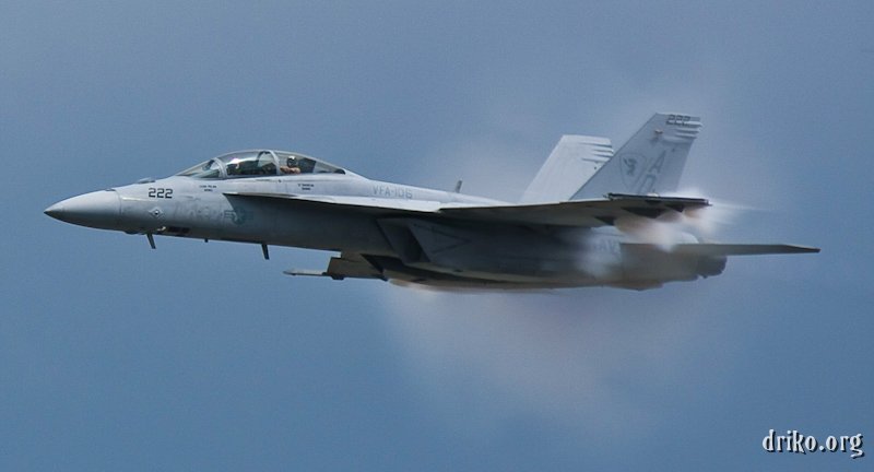 IMG_5485_800.jpg - As the Super Hornet makes its fast pass, it hits transonic speeds, evidenced by the shock waves forming on the leading edges of the wings, engine intakes, and other parts of the fuselage.  Awesome!