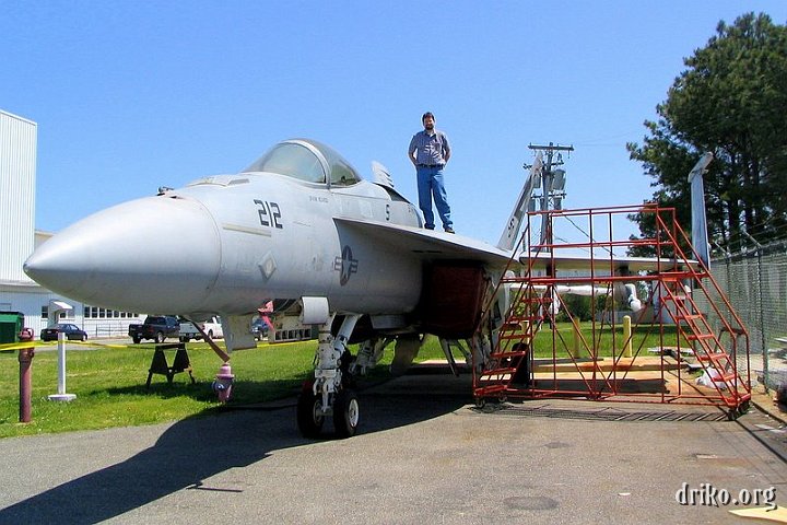 IMG_1664.jpg - Driko on F/A-18E E1   I'm helping design a fixture to mount this F/A-18E (E1, the first test bird) for some sort of signature testing, so I made sure and got myself a picture on top of her. :-) 