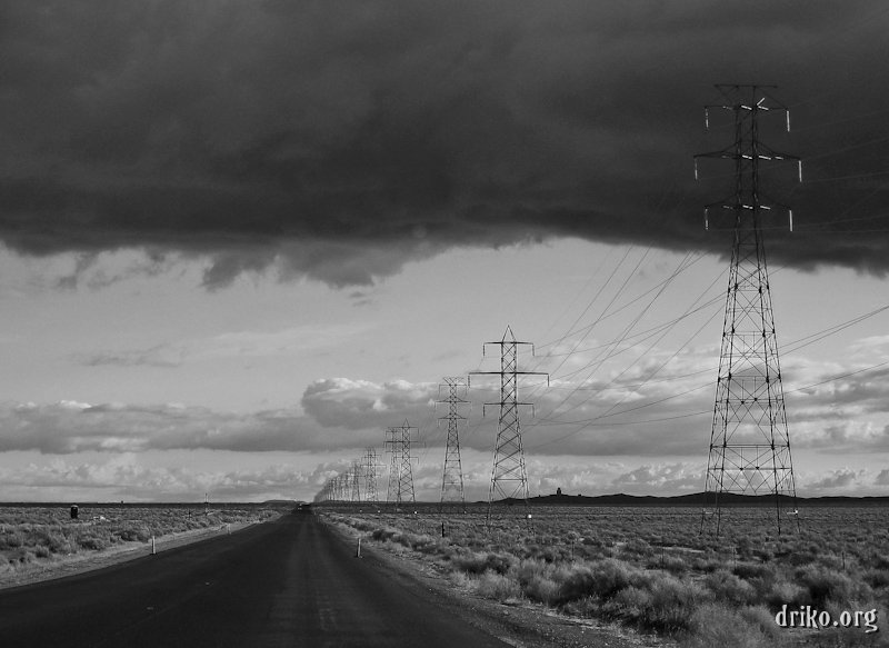 IMG_2155_800-2.jpg - It seems like a lot of the roads I've been on in the Mojave Desert are like this: (deceptively) long and straight.  I tried to capture the geometry of the power lines along the road, and the angry storm cloud added to the moodiness of the desert.  We barely outran this storm on our trip back to Las Vegas from China Lake, CA.